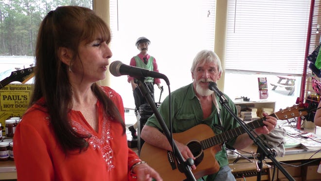 Ginger and "Captain" Cal Ussery perform at Paul's Place on a recent Sunday.
