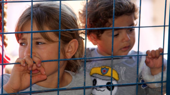Children in an Iraqi refugee camp. STAN RAPADA/COURTESY