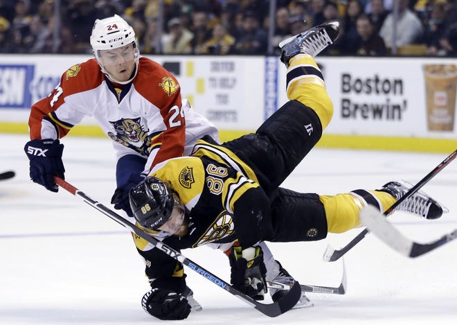 Defenseman Kevan Miller, front, and the Bruins fell to the Panthers, 4-1, on Thursday for their fifth straight loss as the Bruins fight for a playoff spot down the stretch of the NHL regular season. The Associated Press