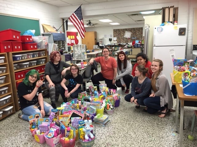 Students in the Youth-2-Youth organization at New Philadelphia High School with Easter baskets that were made to distribute around the community. Pictured are Grace Gump (left), Jaymee Barrett, Aubrey Wigfield, Emily Conrad (adviser), Anna Grasselli, Kejai Murray, Brooke Wigfield and Taleigha Eichel. Not pictured are Jaylynn Huff, Skyla Spitzer, Dalton Miller and Karolin Evert. Brittany Perkowski, another adviser, also is missing from the photo.