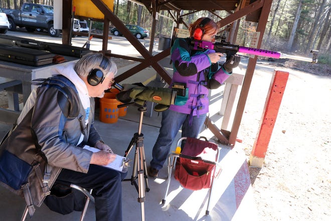 With her husband Douglas manning the spotting scope, Catherine White, of Lexington, shoots her .223 caliber single-shot target rifle at the Woburn Sportsmen's Association in Bedford. The couple is concerned that redefining assault weapons, as initially proposed in a Lexington citizens petition, would ban the types of rifles they use.

 Wicked Local Staff Photo/Ann Ringwood