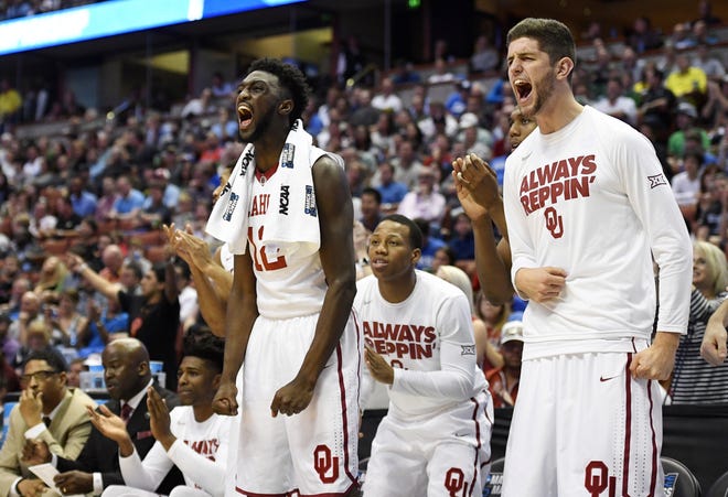 The Oklahoma bench celebrates during its 77-63 win over Texas A&M on Thursday. The Sooners are in the Elite Eight for the first time since 2009. (AP Photo/Mark J. Terrill)