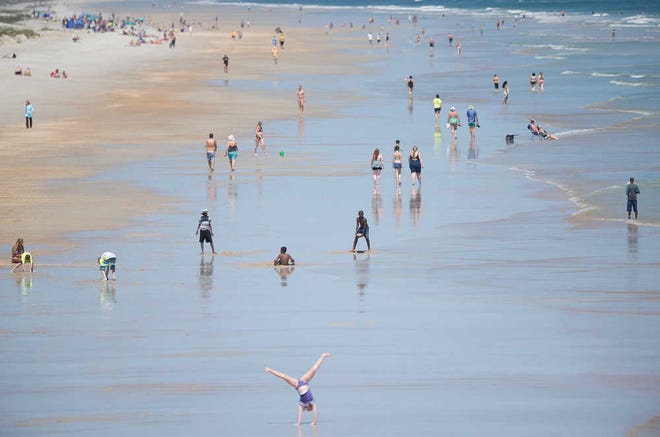 PETER.WILLOTT@STAUGUSTINE.COMWith area schools out on spring break, locals and tourist spend the day on a crowded St. Augustine Beach on Wednesday, March 23, 2016.