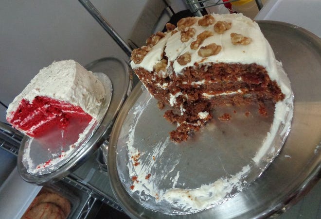 Red Velvet Cake and Carrot Cake are two of many cakes, as well as cupcakes and cookies, lining the shelves at Touch of Velvet Bakery.