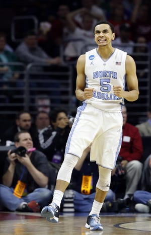 North Carolina's Marcus Paige reacts during the second half of the team's NCAA college basketball game against Indiana in the regional semifinals of the men's NCAA Tournament, early Saturday, March 26, 2016, in Philadelphia.