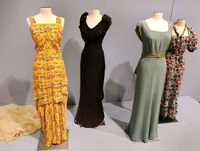 A yellow printed evening gown by Hattie Carnegie (left), an Elsa Schiaparelli evening dress from France and afternoon dresses from the 1940s show how American designers stepped into the limelight during World War II, when travel to Paris was not an option for style-setters.