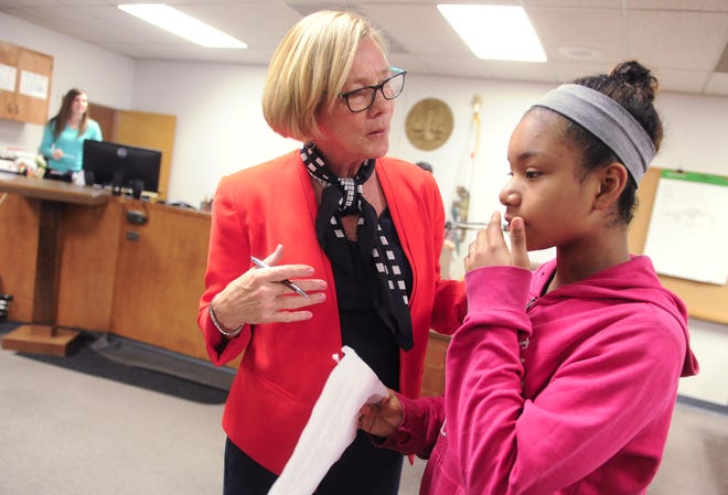 Superior Court Judge Linda Lofthus with Tully C Knoles student Cassandra Ferdan, 11, discusses the court process as they act as judge, jury, witnesses and attorney in mock trial involving the Big Bad Wolf and the Three LIttle PIgs. CALIXTRO ROMIAS/THE RECORD