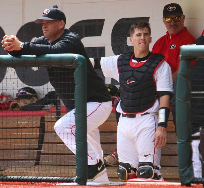 Georgia head coach Scott Stricklin watches from the dugout during the NCAA baseball game between Georgia and Kentucky at Foley Field on Sunday, March 20, 2016 in Athens, Ga. (Photo by Emily Selby)