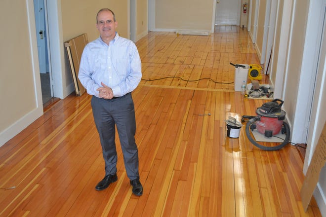 Todd Deluca, president of the Exeter Area Chamber of Commerce, stands in the area that will be the lounge and café of the new shared workspace – called the Chamber Loft – on the fourth floor of 24 Front St. Paul Briand photo