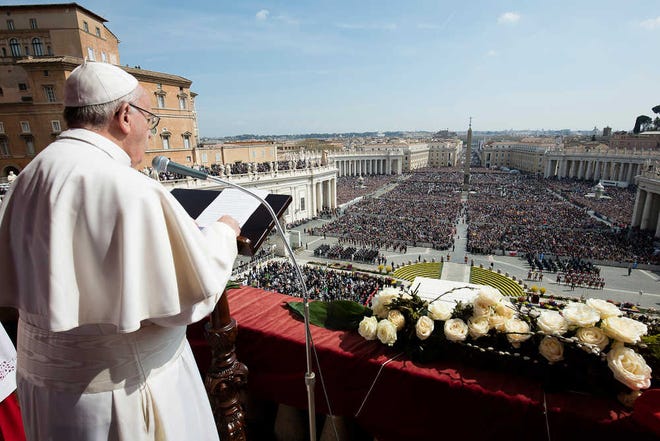 Pope Francis delivers the Urbi et Orbi (to the city and to the world) message at end of the Easter mass, in St. Peter's Square, at the Vatican, Sunday, March 27, 2016. Pope Francis tempered his Easter Sunday message of Christian hope with a denunciation of ''blind'' terrorism, recalling victims of attacks in Europe, Africa and elsewhere, as well as expressing dismay that people fleeing war or poverty are being denied welcome as European countries squabble over the refugee crisis. (L'Osservatore Romano/pool photo via AP)