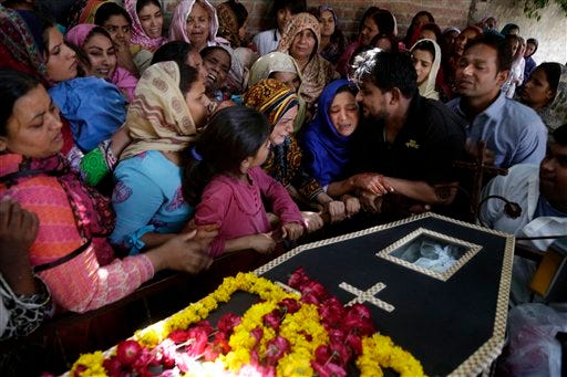 Pakistani Christian women mourn the death of Sharmoon who was killed in a bombing attack in Lahore, Pakistan, on Monday, March 28, 2016.