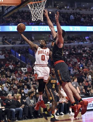 Chicago Bulls guard Aaron Brooks (0) goes to the basket against Atlanta Hawks forward Kris Humphries (43) during the first half of an NBA basketball game in Chicago, Monday, March 28, 2016. (AP Photo/David Banks)