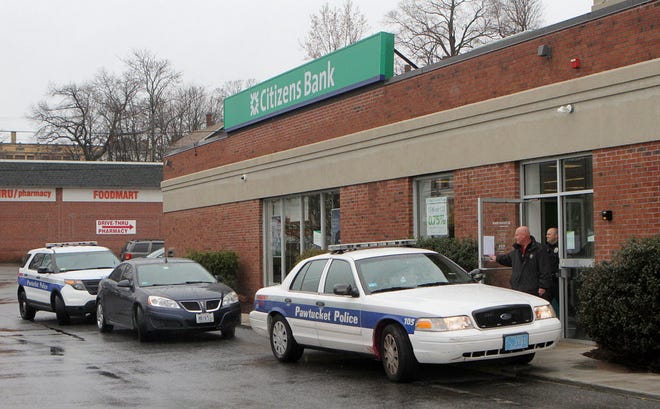 Pawtucket police investigate a robbery at the Citizens Bank on East Ave. in Pawtucket on Monday morning.