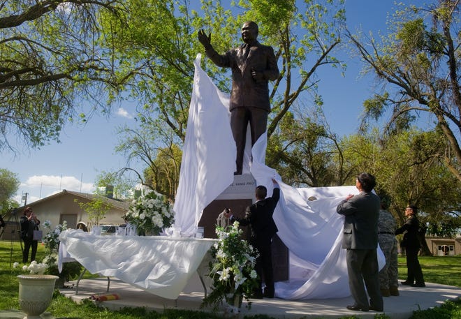 Hundreds of people, including officials from as far away as Thailand, gathered for the unveiling of a 10-foot-tall statue dedicated to Hmong Gen. Vang Pao at the San Joaquin County Fairgrounds in Stockton on Monday. Pao, a commander who led U.S. covert operations in Laos during the Vietnam War, spent the rest of his life as a civilian leader and father to the Hmong people, event organizers said. CLIFFORD OTO/THE RECORD
