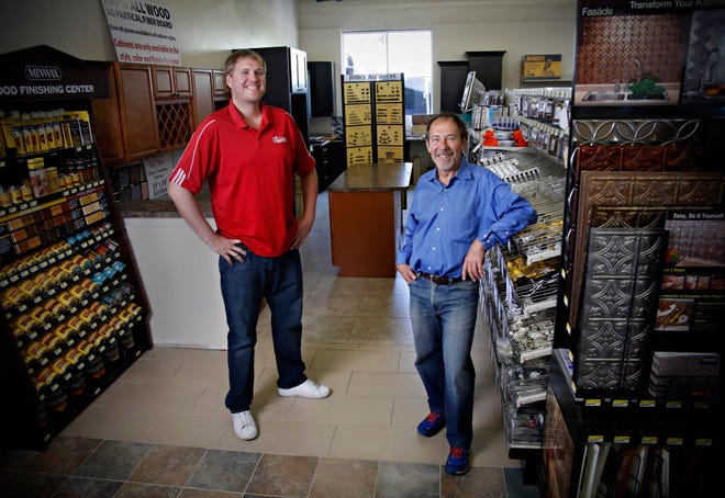 Co-owners Johnathon Burrill, left, and Gary Anglin, right, are shown at their downtown hardware store, ReUser Building Products, Inc.