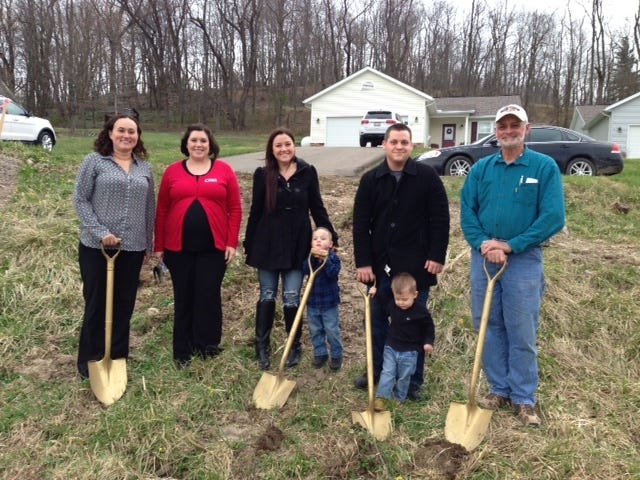 A groundbreaking is held for the Holmes County Habitat for Humanity’s new home on Elm Drive in Millersburg, which is being built in partnership with Robert and Jami Anderson and their two children. Pictured, from left: Holmes County Habitat for Humanity President Kristy Bowling; Kendra Gundrum, HFH Family Support for the Anderson family; Jami and Robert Anderson with their children; and Pete Hilty, HFH board member and construction manager. PHOTO PROVIDED