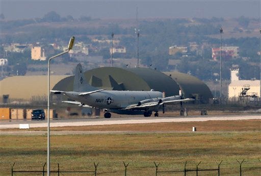 FILE - In this July 28, 2015 file photo, a U.S. Navy plane maneuvers on the runway of the Incirlik Air Base, in Adana, in the outskirts of the city of Adana, southeastern Turkey. The State Department and Pentagon ordered the families of U.S. diplomats and military personnel Tuesday, March 29, 2016, to leave posts in southern Turkey due to "increased threats from terrorist groups" in the country. The two agencies said dependents of American staffers at the U.S. consulate in Adana, the Incirlik air base and two other locations must leave. The so-called "ordered departure" notice means the relocation costs will be covered by the government.