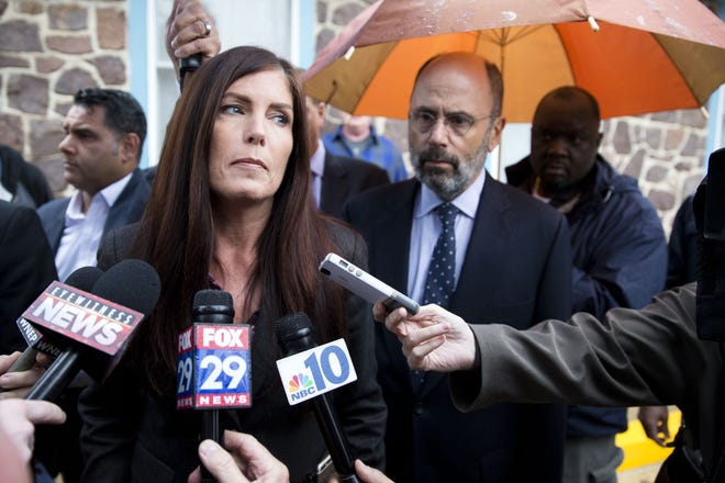 (File) Pennsylvania Attorney General Kathleen Kane speaks with members of the media after her arraignment before a district judge on Thursday, Oct. 1, 2015, in Collegeville. Kane's law license has been suspended as she fights criminal charges accusing her of leaking secret grand jury information and lying about it. An Aug. 8, 2016, trial date has been set by Montgomery County Judge Wendy Demchick-Alloy.