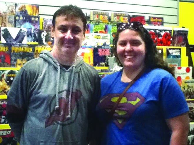 "If I'm being completely honest, I didn't think the guys actually worked in the store," says Faith, here with "Comic Book Men" star Walt Flanagan.