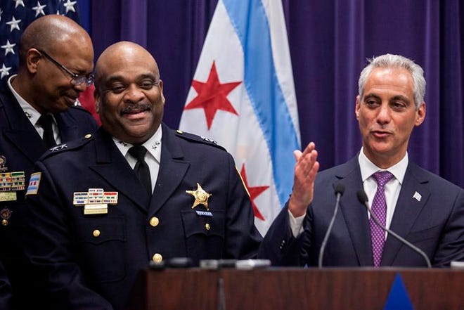 Mayor Rahm Emanuel, right, introduces Eddie Johnson, the current Chief of Patrol, as the interim superintendent of the Chicago Police Department on Monday.
