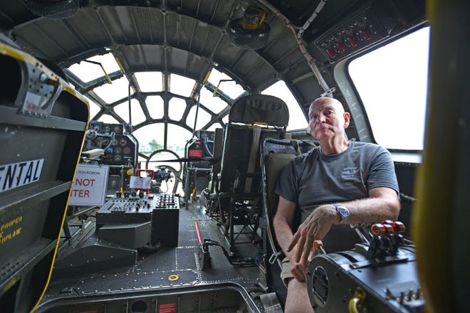 Stuart Watkins sits in the world's last flying B-29 Superfortress at Sun Aviation in Leesburg on Monday. The aircraft is available for the public to view today.