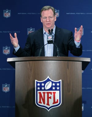 FILE - In this March 23, 2016, file photo, NFL Commissioner Roger Goodell gestures during a press conference at the NFL owners meeting in Boca Raton, Fla. The NFL has demanded The New York Times retract a story that called the league's concussion research flawed and likened the NFL's handling of head trauma to the tobacco industry's response to the dangers of cigarettes. In a letter from its law firm to the general counsels of the newspaper and obtained by The Associated Press on Tuesday, March 29, 2016, the league said it was defamed by the Times. (AP Photo/Luis M. Alvarez, File)
