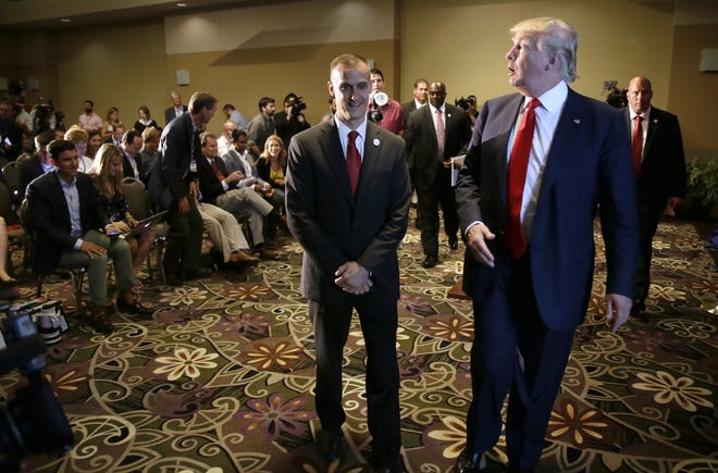 In this Aug. 25, 2015 file photo, Republican presidential candidate Donald Trump, right, walks with his campaign manager Corey Lewandowski after speaking at a news conference in Dubuque, Iowa. Breitbart News reporter Michelle Fields, who said that she was grabbed by Lewandowski as she attempted to question Trump in Florida on Tuesday, March 8, has resigned from the conservative website, saying that she can't work for an organization that doesn't support her. AP Photo/Charlie Neibergall, File