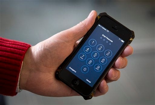 FILE - In this Feb. 17, 2016 file photo, an iPhone is seen in Washington. The FBI’s announcement that it mysteriously hacked into an iPhone is a setback for Apple and increases pressure on the technology company to restore the security of its flagship product. (AP Photo/Carolyn Kaster, File)