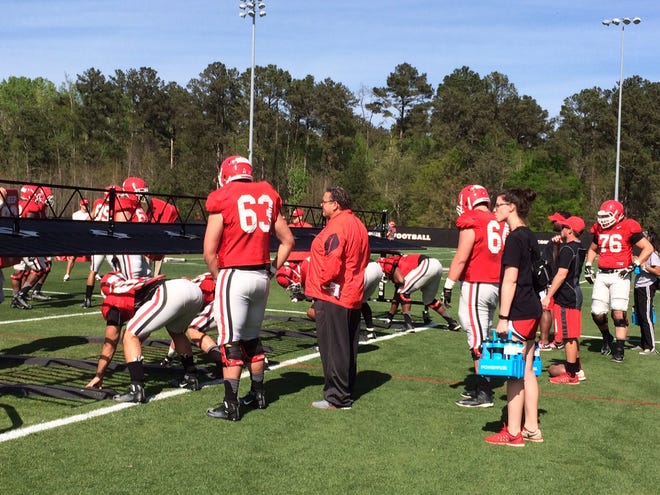 Georgia offensive line coach Sam Pittman works with his unit at practice on March 30, 2016 (Marc Weiszer/Staff)