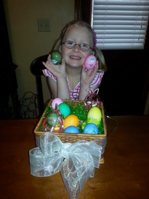 Annaleigh Morgan, granddaughter of Scott and Susan Nanney of Kings Mountain. shows off her Easter eggs.