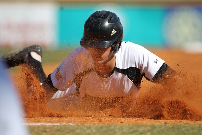 Kings Mountain's Will Wilson slides safely into first base Tuesday afternoon against Stuart Cramer at Keeter Stadium/Veterans Field in Shelby. (Hannah Covington/Halifax Media Group)