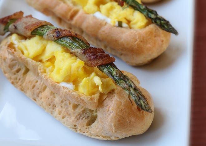 Bring something new to the table with savory eclairs filled with scrambled eggs and a selection of accompaniments.