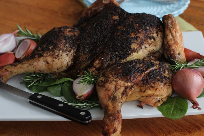 A roasted spatchcocked chicken seasoned with a blend of coffee, cayenne and cumin. Spatchcocking a chicken, also called butterflying, can reduce roasting time almost by half.

AP Photo/Matthew Mead