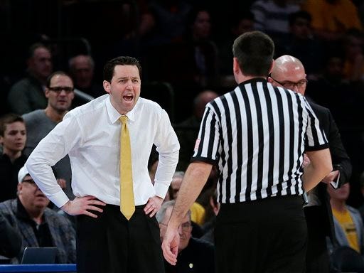 Valparaiso head coach Bryce Drew, left, argues a call during the first half of an NCAA basketball game against BYU in the semifinals of the NIT on Tuesday, March 29, 2016, in New York. Valparaiso won 72-70. (AP Photo/Frank Franklin II)