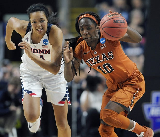 UConn's Napheesa Collier chases after Texas' Lashann Higgs Monday during their NCAA Tournament game in Bridgeport. THE ASSOCIATED PRESS