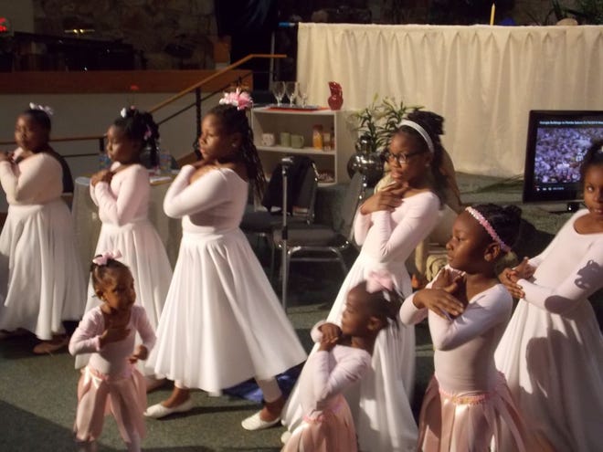 Youth praise dancers perform to “Oh What Love” by Vickie Winans during the Easter program at Mount Carmel Baptist Church.