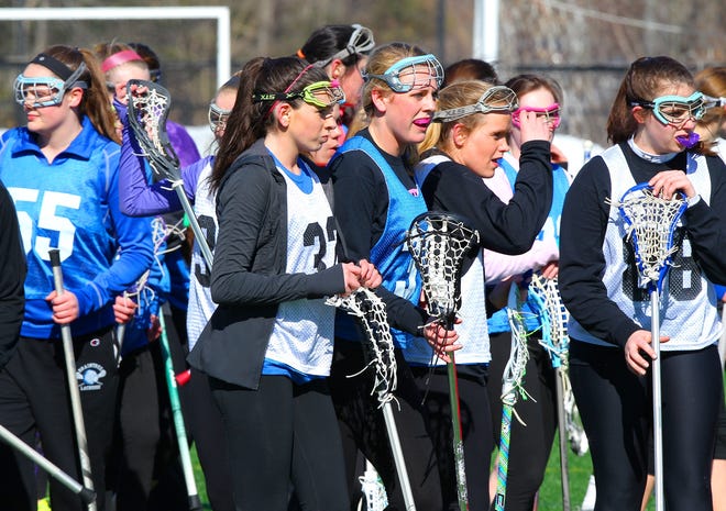 Braintree High School girls lacrosse team got outdoors for a practice last year once the snow was removed from turf field. GARY HIGGINS FILE PHOTOS / THE PATRIOT-LEDGER