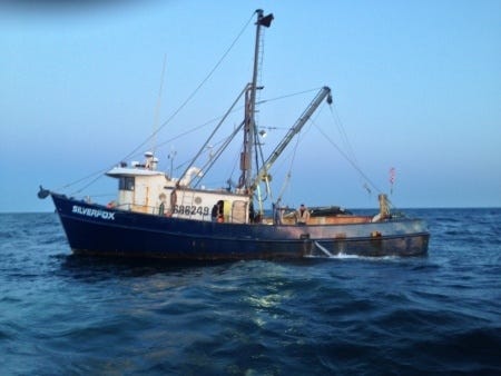 The fishing vessel Silver Fox uses a pump to dewater after it began taking on water south of Monomoy Island on Wednesday. Silver Fox was one of two fishing boats rescued by Coast Guard crews off the Massachusetts coast Wednesday morning. Courtesy photo / U.S. Coast Guard photo