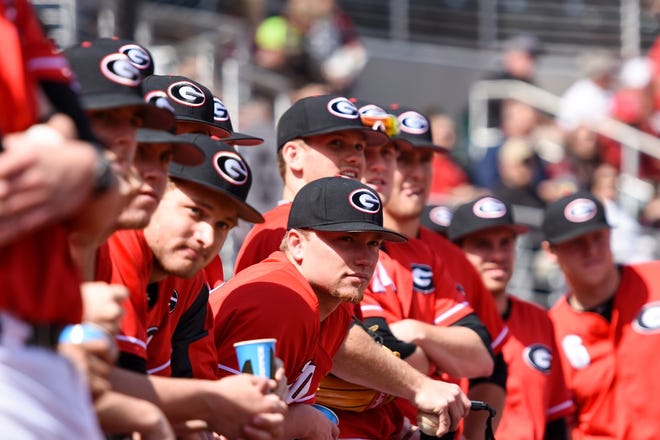 Members of the Georgia Baseball team watch the intro video before the start of an NCAA baseball game between Georgia and Wright State at Foley Field in Athens, Ga. on Saturday, Mar. 5, 2016. (UGA sports communications)