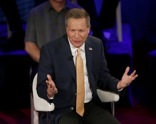 Republican presidential candidate Ohio Gov. John Kasich responds to a question from the audience during a CNN town hall with Anderson Cooper in the historic Riverside Theatre, Tuesday, March 29, 2016, in Milwaukee. (AP Photo/Charles Rex Arbogast)