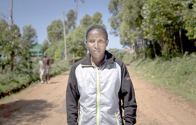 Kenyan runner Lilian Mariita poses for a portrait Feb. 1 on the dirt road outside her house in the village of Nyaramba in western Kenya. The 27-year-old's racing career is over, and now she is back at square one: in Nyaramba, the muddy tea-plantation village in western Kenya she thought she'd escaped in 2011, when she left for the promise of a new life pounding American roads. Included in that promise was a third place finish in her age group at th 2011 Boilermaker. 

AP Photo/Ben Curtis