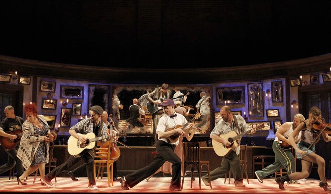 Members of the cast of 'Once' perform on stage. The actors in 'Once' all play musical instruments and play on stage during the show. Photo by Jeff Busby.