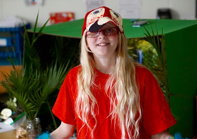 10-year-old Haley Sanborn dressed up as a Scarlet macaw for the third annual fifth-grade zoo exhibit at Seabrook Middle School.  "It ties everything in together including research, art, creativity, and science," said fifth-grade teacher Amie Heatherton. Photo by Kiki Evans/Seacoastonline
