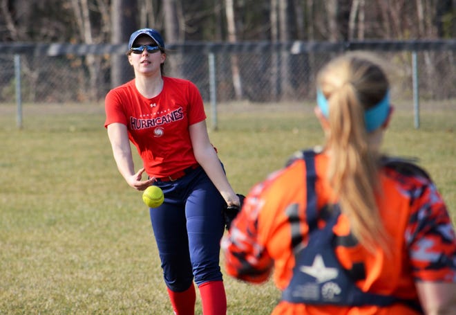 Exeter High School junior Kate Pigsley tosses to catcher Natalie Bruno during Wednesday’s softball practice. Pigsley returns for the Blue Hawks as a third-year starting pitcher. Ryan O’Leary/Seacoastonline