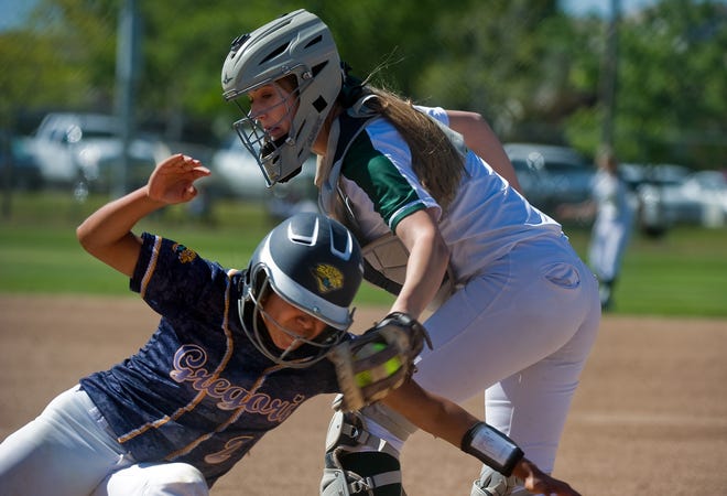 Tracy's Cierra Hylton, right, tags out Gregori's Nichole Alexander during their NorCal Classic softball tournament game Thursday at Tracy Sports Complex. Gregori won 9-2. CLIFFORD OTO/THE RECORD