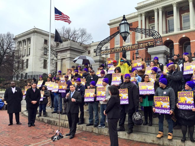 Sen. Sal DiDomenico and Rep. Daniel Ryan recently joined Logan Airport employees and members of 32BJ SEIU at a rally on the steps of the Statehouse in support of S.2125/H.3923, an act relative to fair wages. This bill, which would raise the minimum wage to $15 an hour for Logan Airport service employees, was filed by DiDomenico and Rep. Adrian Madaro and was recently given a favorable report by the Joint Committee on Labor and Workforce Development. Courtesy Photo