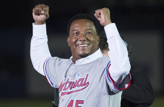 Former Montreal Expos pitcher Pedro Martinez salutes the crowd as he honored in a pre-game ceremony before Friday night's game in Montreal.