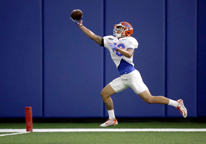 University of Florida wide receiver Freddie Swain makes a one-handed catch during spring practice on Wednesday in Gainesville.