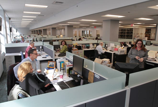 Providence Journal reporters and editors settle into the new newsroom in The Providence Journal Building. The Journal has consolidated its operations and moved into refurbished offices on the second floor. The Providence Journal/Sandor Bodo