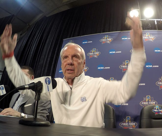 North Carolina coach Roy Williams gestures as he talks during a news conference Sunday. The Associated Press